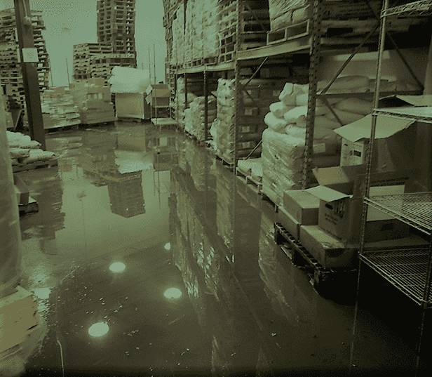 A Warehouse Floor Flooded with Dirty Water